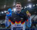 Bild: Aurelien Morissard/AP/dpa
Moritz Wesemann feiert seinen Sieg mit der Goldmedaille.