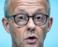 Bild: Michael Kappeler/dpa
Merz: „„Wir müssen uns aus einem Tief herausarbeiten.“