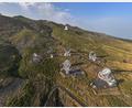 Bild: ---/LST Collaboration/Eurekalert/dpa
Auf der kanarischen Insel La Palma stehen vier riesige, aus zahlreichen Facetten bestehende Spiegel. (Handout)