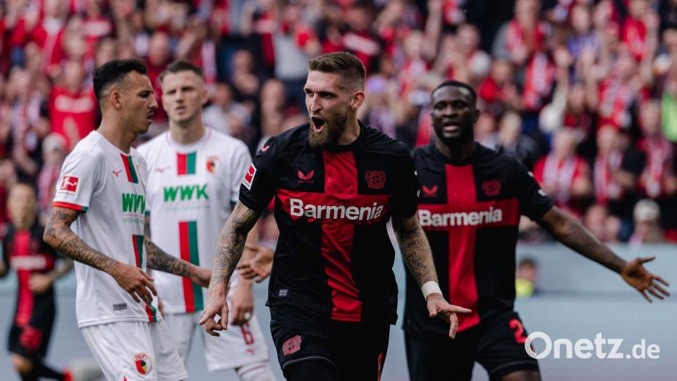 Robert Andrich (M) bejubelt seinen Treffer und später die Meisterschaft. Bild: Marius Becker/dpa