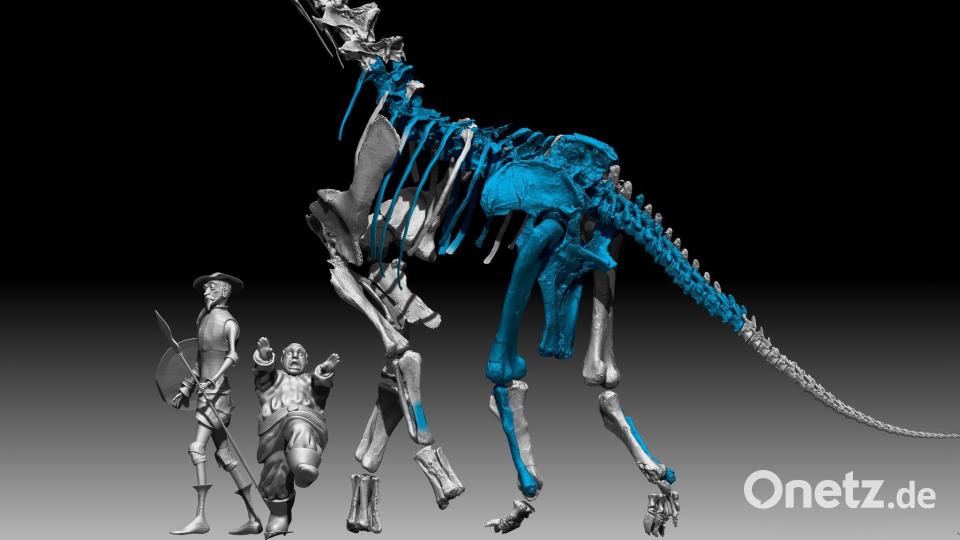 Die Romanfiguren Don Quichotte und sein Gehilfe Sancho Pansa sind in dieser Illustration neben dem neu entdeckten Dinosaurier zu sehen. Bild: Gbe-Uned/dpa