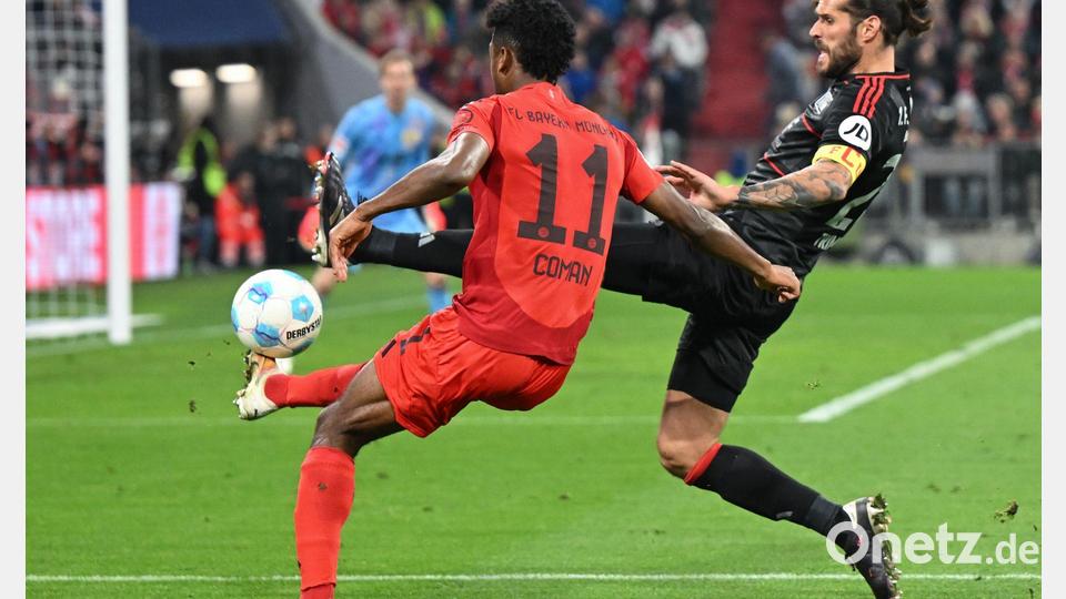In Spiellaune: Bayerns Kingsley Coman (l) im Zweikampf mit Christopher Trimmel. Bild: Sven Hoppe/dpa
