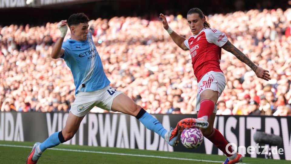 Man Citys Phil Foden im Duell mit Arsenals Riccardo Calafiori. Bild: John Walton/PA Wire/dpa