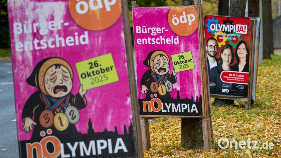 Befürworter und Gegner werben mit Plakaten in München vor dem Olympia-Bürgerentscheid. Bild: Peter Kneffel/dpa