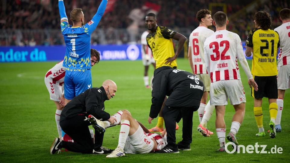 Kölns Timo Hübers wird auf dem Feld behandelt. Bild: Bernd Thissen/dpa