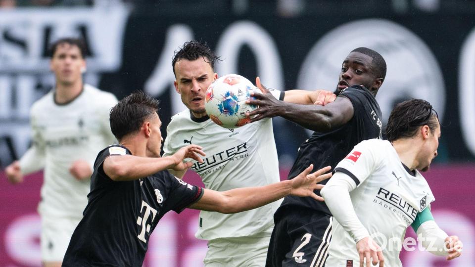 Kampf um jeden Ball im Borussia-Park. Bild: Marius Becker/dpa