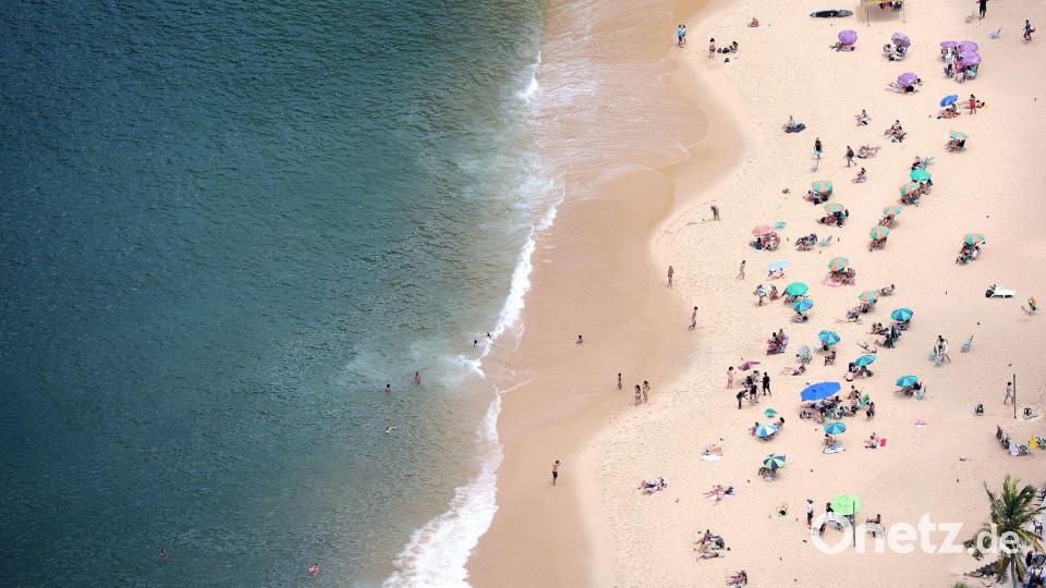 In Rio de Janeiro ist jetzt Frühling und Menschen sonnen sich am Strand. Bild: Chris Jackson/PA Wire/dpa