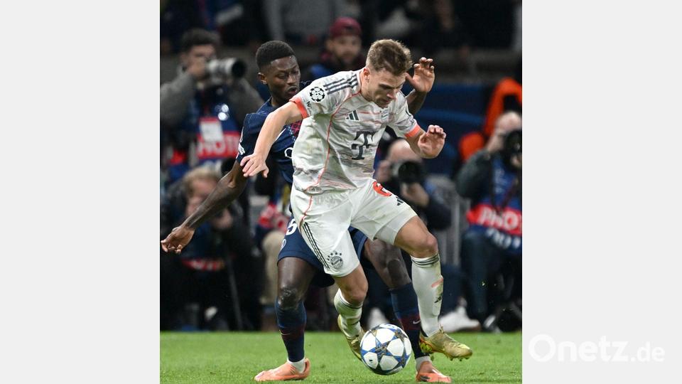 Joshua Kimmich in seinem 100. Champions-League-Spiel in Aktion gegen Nuno Mendes . Bild: Federico Gambarini/dpa