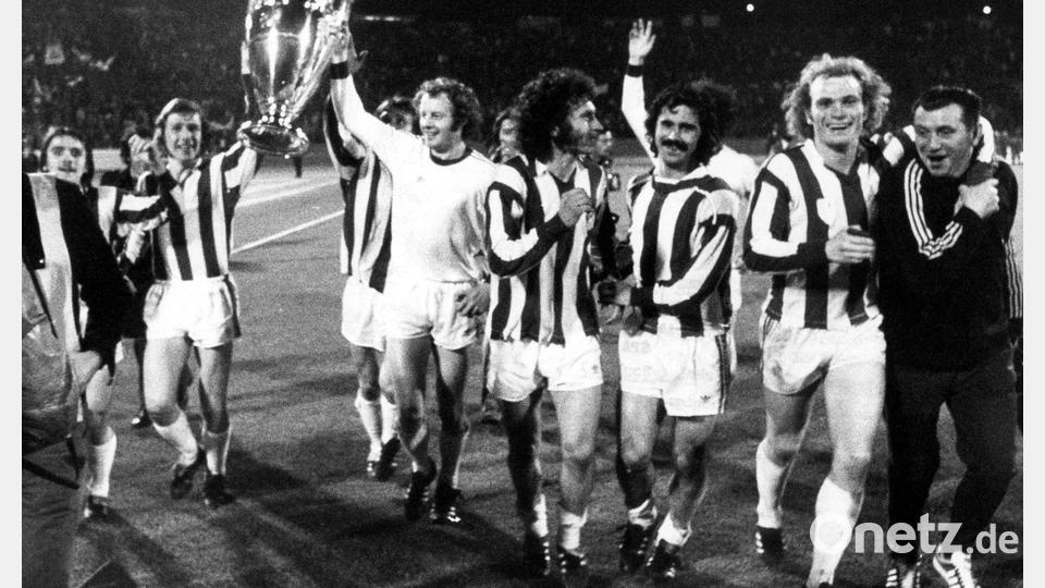 Die Bayern mit Paul Breitner (Mitte), Gerd Müller (3.v.r.) und Uli Hoeneß (2.v.r.) jubeln nach dem Gewinn des Europapokals der Landesmeister. (Archivfoto) Bild: picture-alliance / dpa