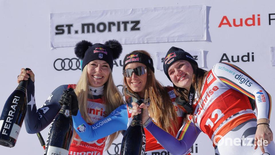 Schampus für das Top-Trio in der Abfahrt. Bild: Luciano Bisi/AP/dpa