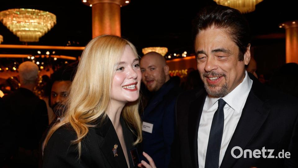 Elle Fanning und Benicio Del Toro im Gespräch: Dieses Mittagessen lässt sich niemand entgehen. Bild: Caroline Brehman/Invision/AP/dpa
