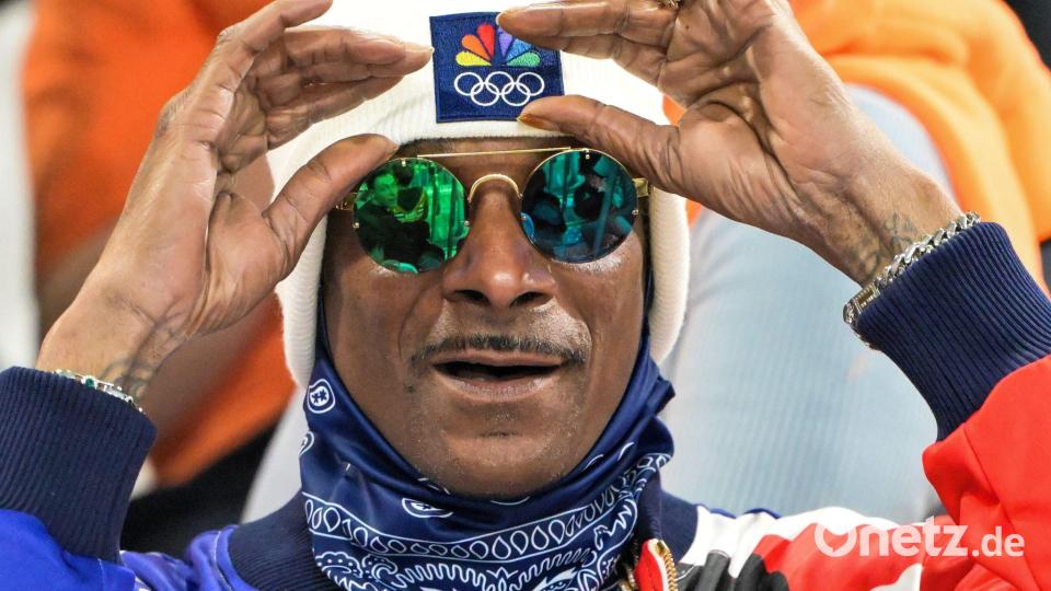 Auch Rap-Ikone Snoop Dogg verfolgte die 500 Meter der Frauen. Bild: Peter Kneffel/dpa