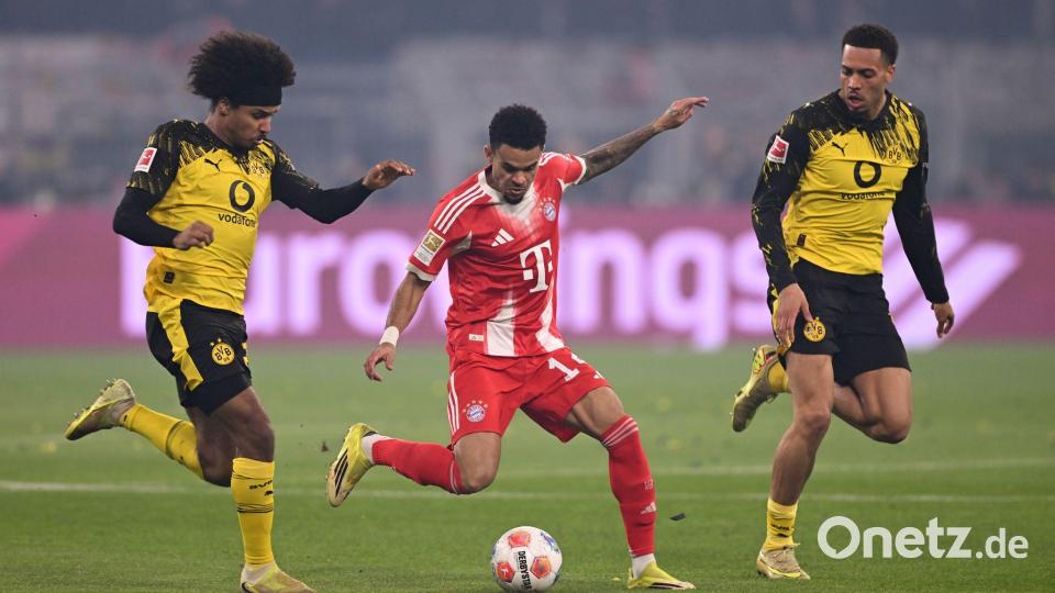 Luis Díaz umzingelt von zwei Dortmundern. Bild: David Inderlied/dpa