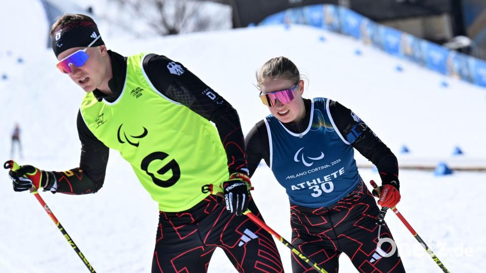 Linn Kazmaier (r) und Guide Florian Baumann. (Archivbild) Bild: Martin Schutt/dpa
