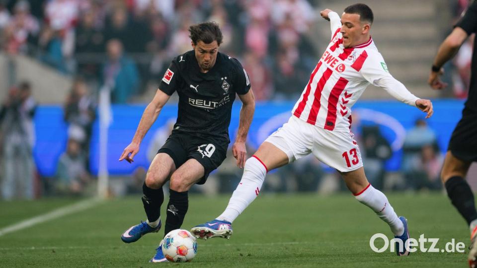 Rivalen am Rhein: Kölns Torschütze Said El Mala (r) im Zweikampf mit dem Gladbacher Joe Scally. Bild: Marius Becker/dpa