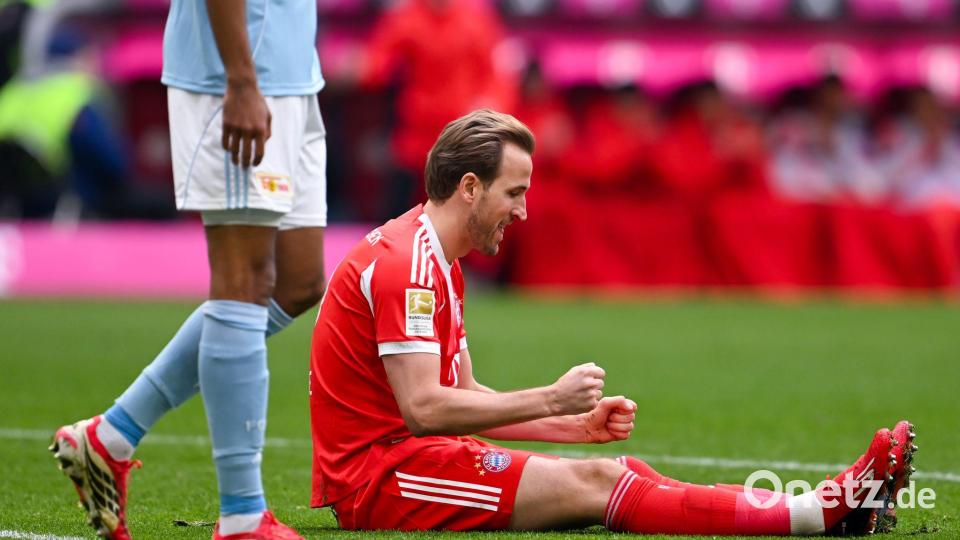Harry Kane ballt nach seinem 31. Saisontor auf dem Rasen sitzend die Fäuste. Bild: Sven Hoppe/dpa