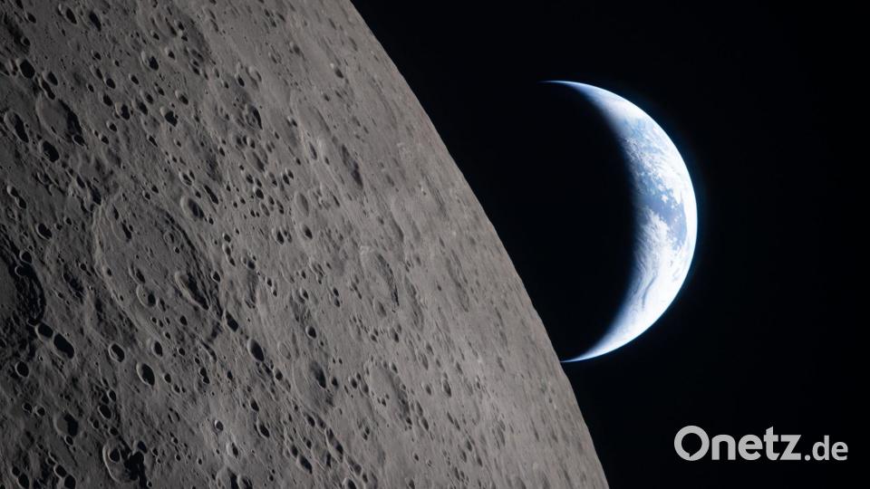 Dieses von der NASA zur Verfügung gestellte Foto zeigt die Erde, die hinter dem Mond untergeht. Bild: Uncredited/NASA´/AP/dpa