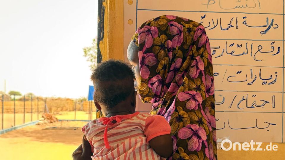 Auch nach der Flucht sind Frauen und Mädchen durch Gewalt gefährde - Wahiba hält ihr Kind auf dem Arm. Bild: Eva Krafczyk/dpa