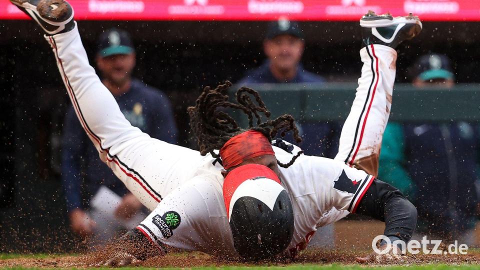 Schlagmann der Minnesota Twins, Josh Bell, rutscht sicher auf die Home Plate. Bild: Matt Krohn/AP/dpa