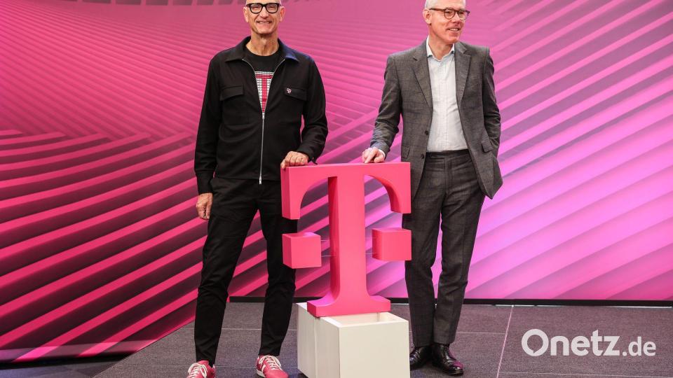 Die Magenta-Manager Tim Höttges (links) und Christian Illek. Bild: Oliver Berg/dpa