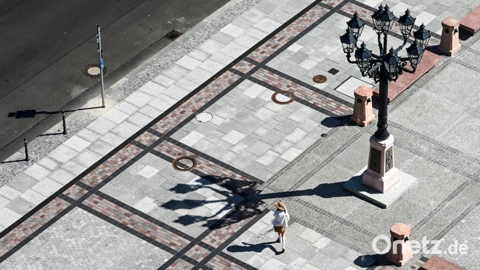 Versiegelte Flächen speichern die Hitze. Bild: Jens Kalaene/dpa