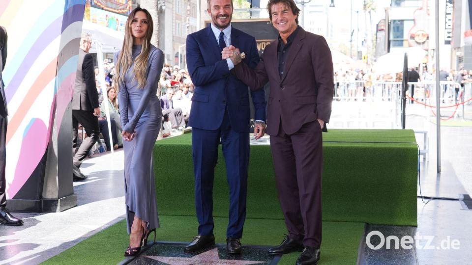 Victoria Beckham, David Beckham und Tom Cruise posierten auf dem Hollywood Walk of Fame vor David Beckhams neuem Stern. Bild: Chris Pizzello/Invision/AP/dpa