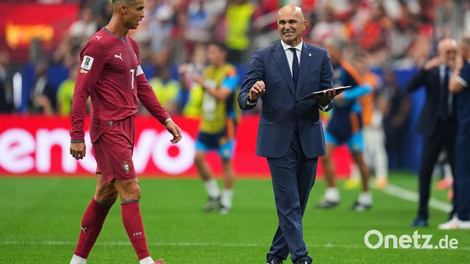 Der Trainer und das Idol: Portugals Roberto Martinez (r) mit Cristiano Ronaldo. Bild: Julio Cortez/AP/dpa