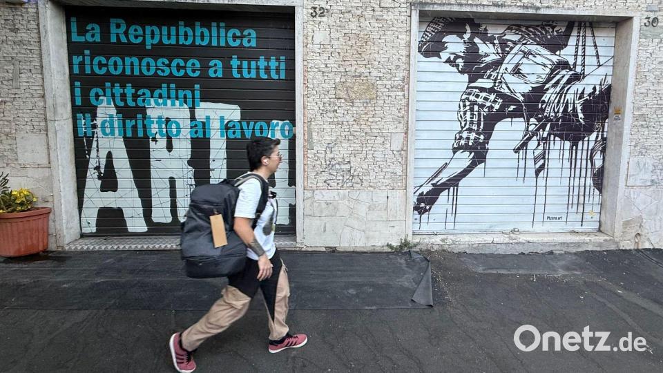 Anders als in den deutschen Innenstädten mit ihren vielen Schaufenstern hat in Italien noch so gut wie jedes Geschäft die schweren metallenen Rollläden. Bild: Christoph Sator/dpa