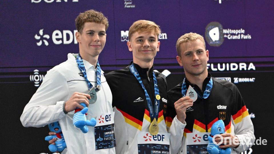 Johannes Liebmann (M) und Oliver Klemet (r) sind Konkurrenten und Freunde. Bild: Emma Da Silva/AP/dpa