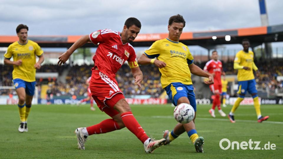 Rani Khedira von Union Berlin (l) und Max Marie von Eintracht Braunschweig im Zweikampf. Bild: Swen Pförtner/dpa