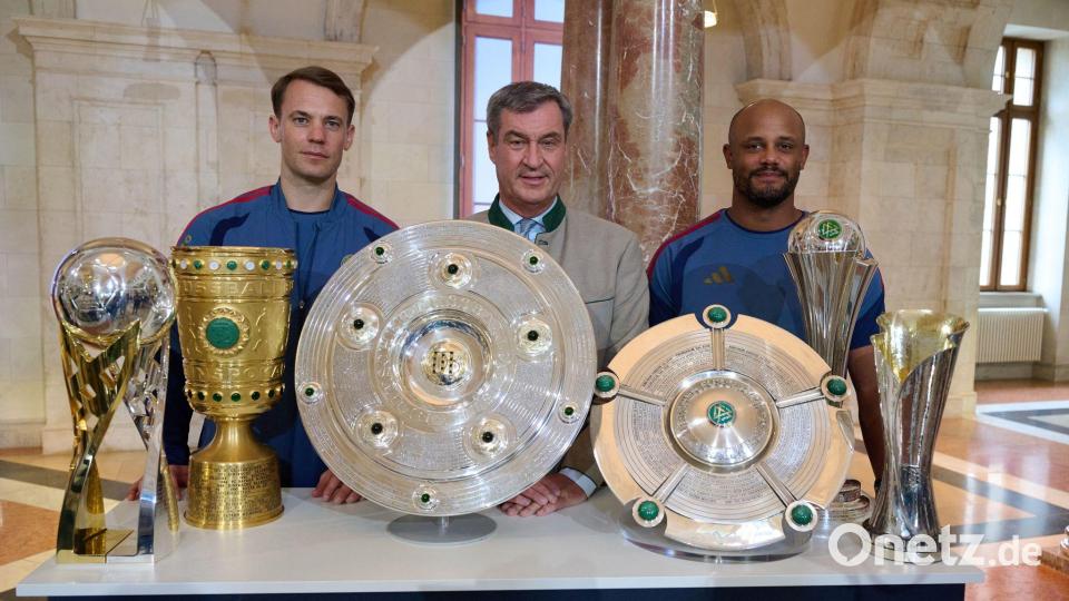 Der FC Bayern und Ministerpräsident Markus Söder (M) werben für Olympia. Bild: Sven Hoppe/dpa
