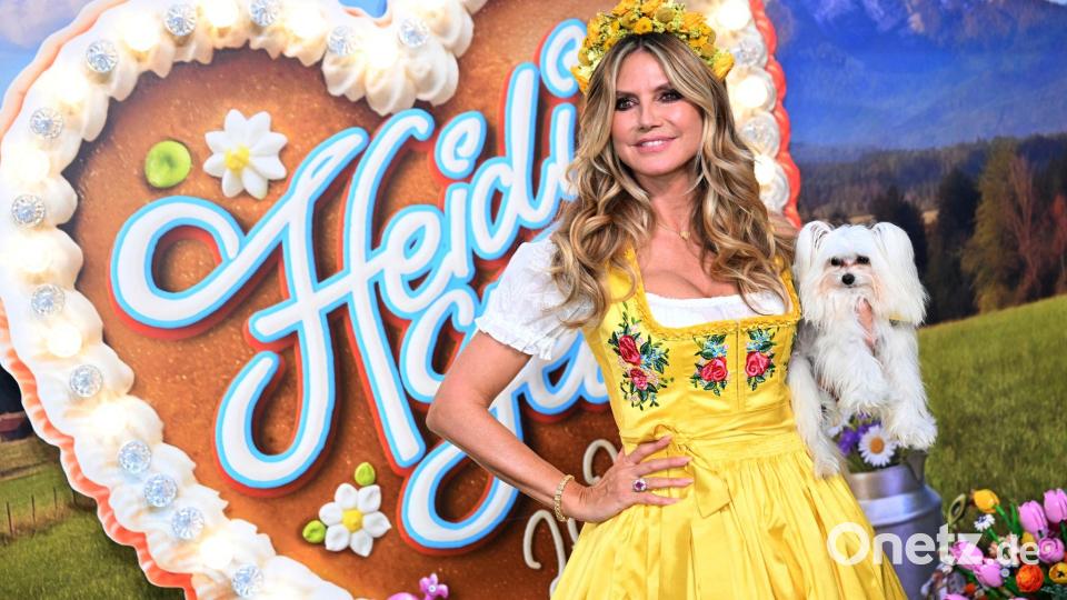 Heidi Klum steht beim "HeidiFest" auf dem roten Teppich im Hofbräuhaus in München. Bild: Felix Hörhager/dpa