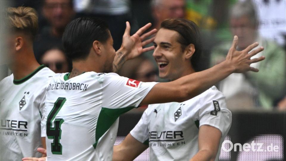 Florian Neuhaus (r) brachte die Borussia früh in Führung. Bild: Federico Gambarini/dpa