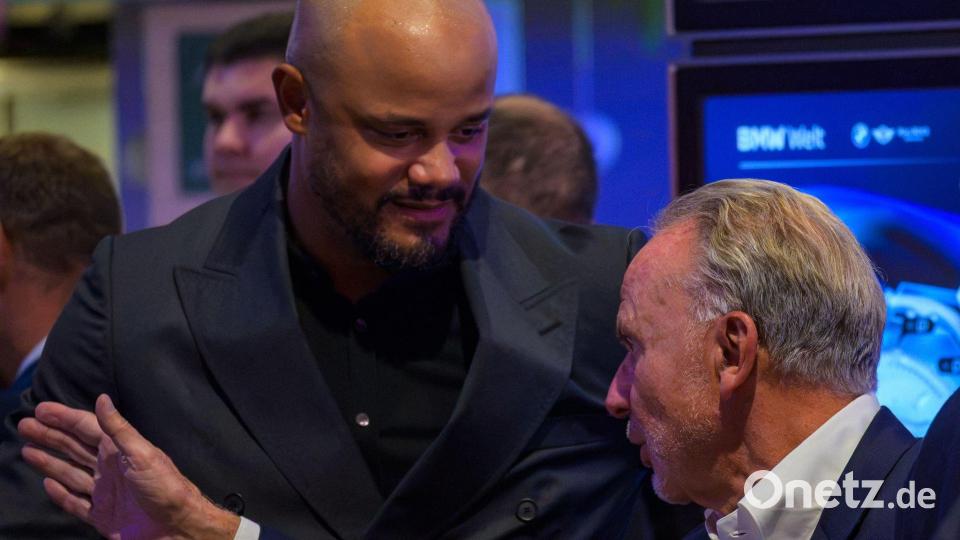 Trainer Kompany und Karl-Heinz Rummenigge. Bild: René Chlopotowski/dpa