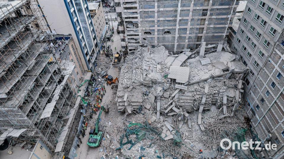 Rettungskräfte führen Such- und Rettungsmaßnahmen an der Stelle eines eingestürzten mehrstöckigen Gebäudes durch, das sich im Stadtteil Eastleigh in Nairobi im Bau befand. Bild: Boniface Muthoni/SOPA Images via ZUMA Press Wire/dpa