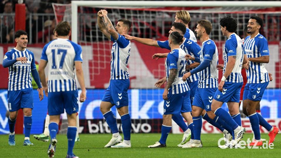 Magdeburg jubelt: Mateusz Zukowski (M) belohnt den wackeren Zweitligisten mit dem 1:1. Bild: Sven Hoppe/dpa