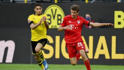 Bild: Federico Gambarini
Dortmunds Achraf Hakimi und Münchens Thomas Müller (l-r.) in Aktion. Foto: Federico Gambarini/dpa-Pool/dpa