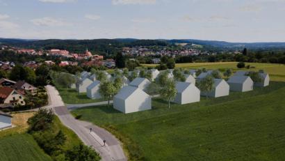 Bild: Binner Architekten/exb
In einer Computersimulation hat Architekt Georg Binner die Häuser des vorgesehenen Baugebiets "Breiter Weg II" rund um die ringförmige Erschließungsstraße drapiert. Die Ansicht zeigt die Ortseinfahrt am Breiten Weg aus Westen mit Blick auf die Stadt.