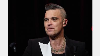 Archivbild: Georg Wendt/dpa
Popsänger Robbie Williams steht auf der Bühne. Foto: Georg Wendt/dpa/Archivbild