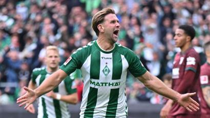 Bild: David Inderlied/dpa
Niclas Füllkrug jubelt über sein Tor gegen Augsburg.